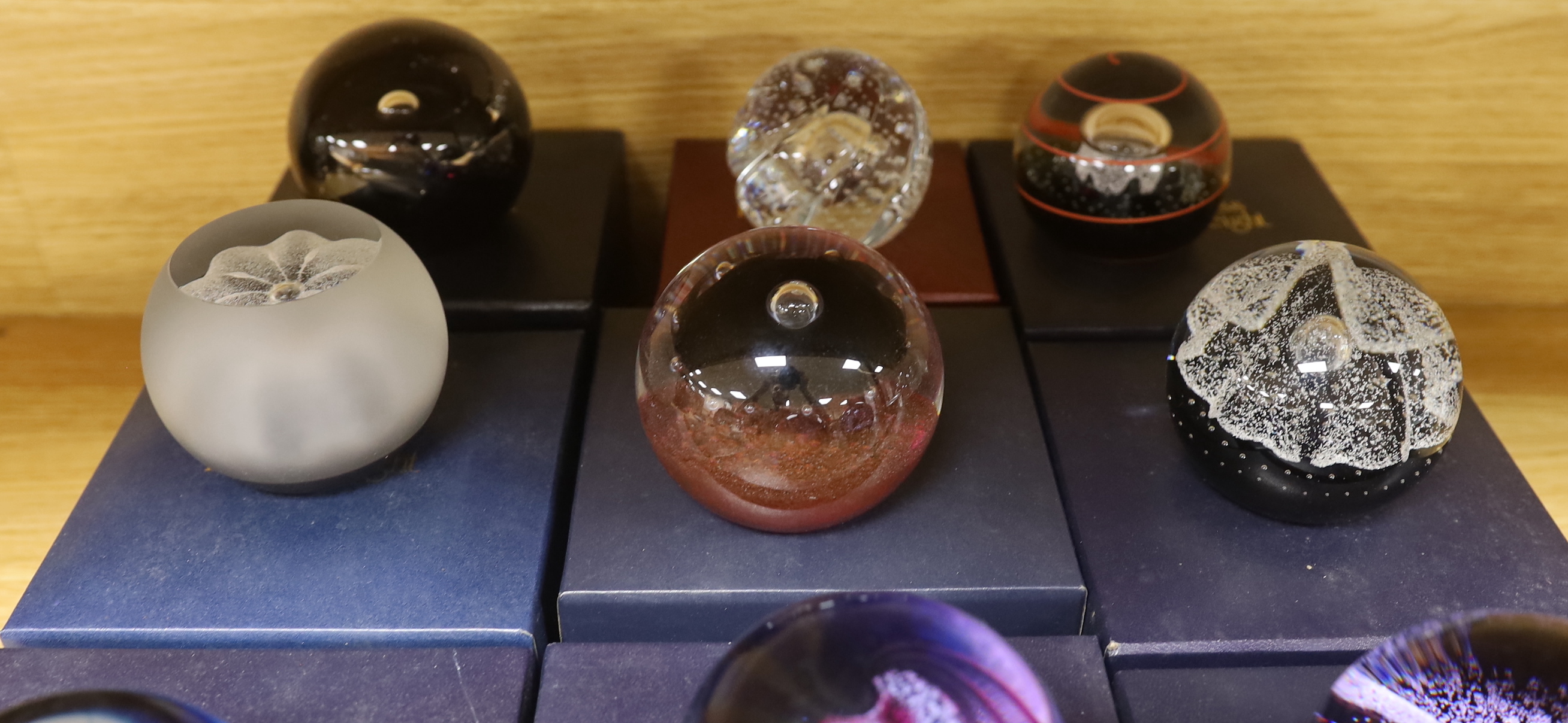 Nine Caithness paperweights including Ice Blossom, limited edition 419/1000 and Touchdown, 361/1000, each with boxes, the largest 7.5cm high